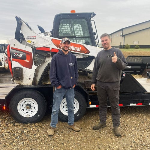Matt Ascheman with 1 customers and a bobcat skidsteer